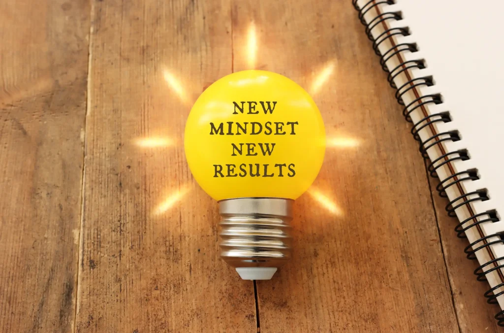 elevation learning lightbulb showing the words 'new mindset, new results'