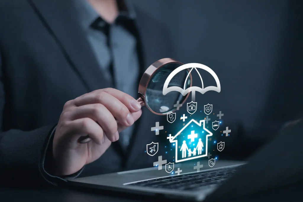 a person holding a magnifying glass, close up on the magnifying glass over an open laptop with icons