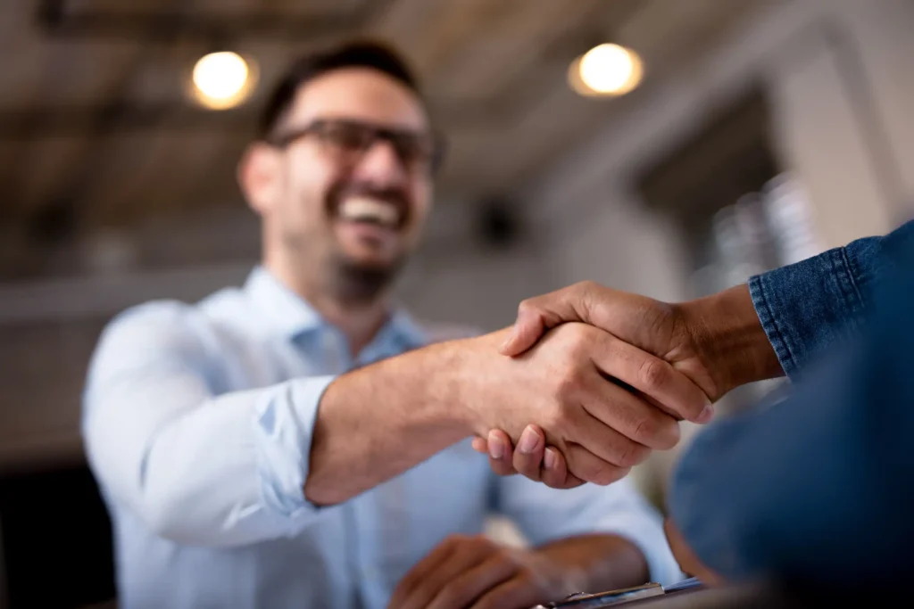 two people shaking hands, close up on the hands